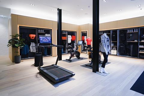 Interior of Peloton store, Covent Garden, London, showing a treadmill and apparel displays
